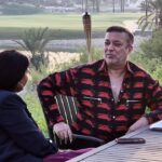 Mahesh Tourani seated in his Emirates Hills mansion, surrounded by luxury and greenery.