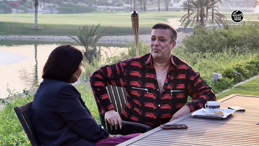 Mahesh Tourani seated in his Emirates Hills mansion, surrounded by luxury and greenery.