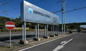 Nippon Steel and U.S. Steel shake hands in front of a steel plan.