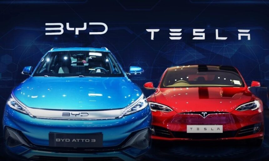 BYD electric car in Europe next to a Tesla Model 3